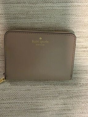 Kate Spade Small zip around wallet.  Black fabric inside